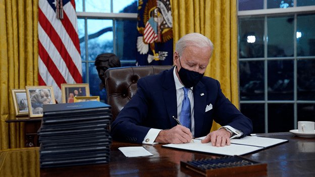 President Joe Biden wearing mask in Oval Office